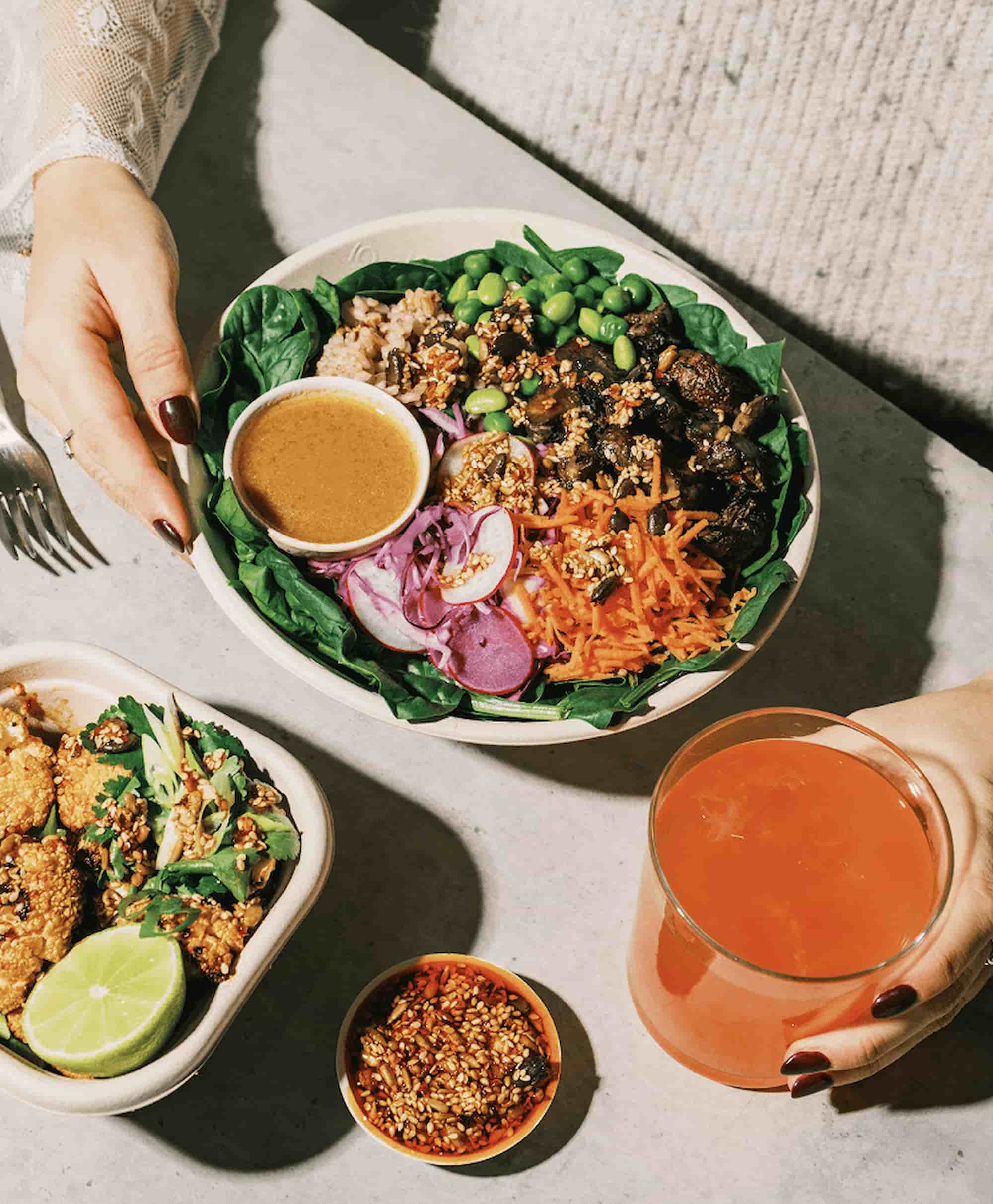 A macro-balanced Prepd bowl with fresh vegetables and dressing